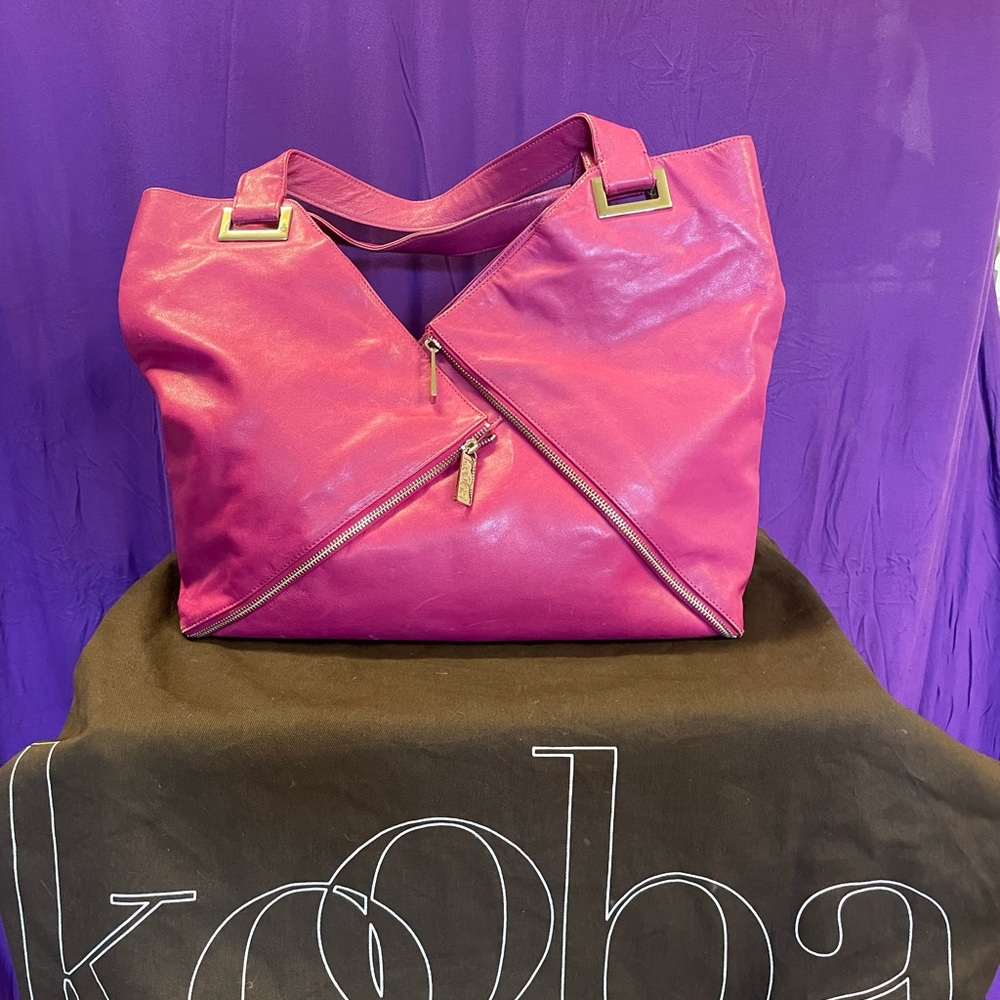 Kooba large purse in a bright pink leather. Great day bag (iPad +shoes will fit!